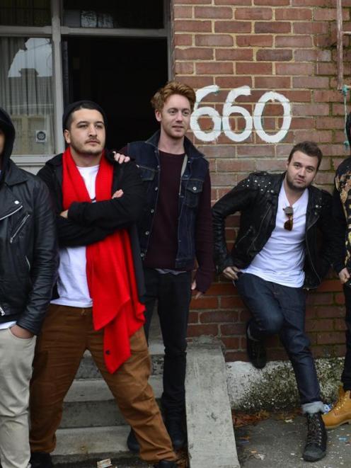 Six60 outside their old flat at 660 Castle Street in Dunedin.