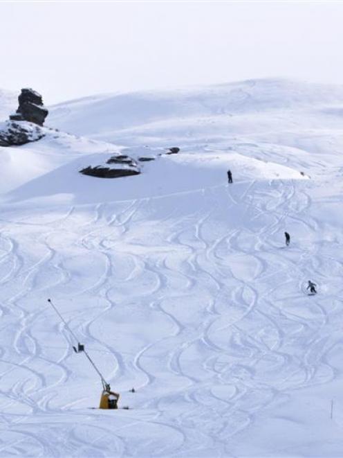 Skiers and snowboarders enjoy fresh tracks at Coronet Peak yesterday. Photo by NZSki.