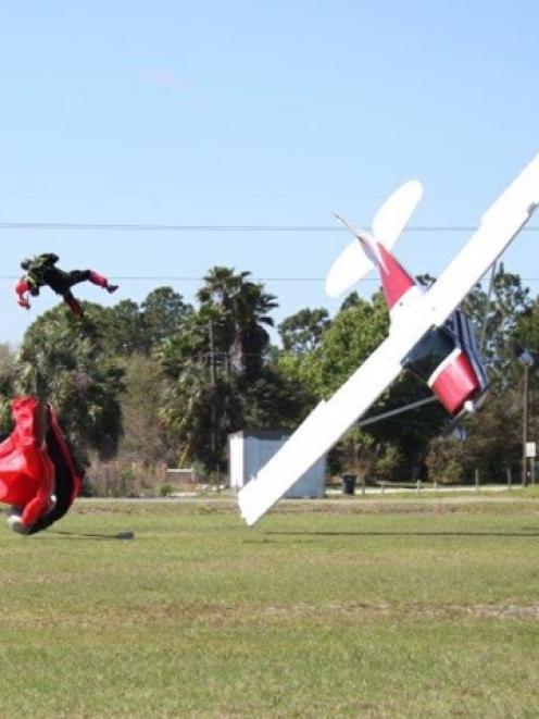 Skydiver John Frost and the Cessna piloted by Shannon Trembley about to hit the ground after...