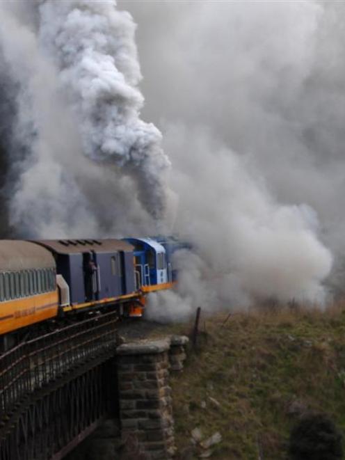 Smoke billows from a burning locomotive (above and below) during a Taieri Gorge Railway excursion...