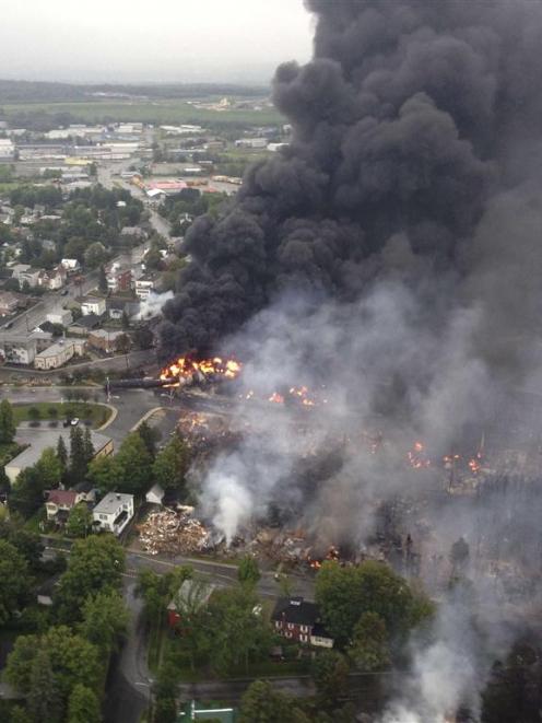 Smoke billows from a fire at the site of a train derailment in Lac Megantic, Quebec.  REUTERS...