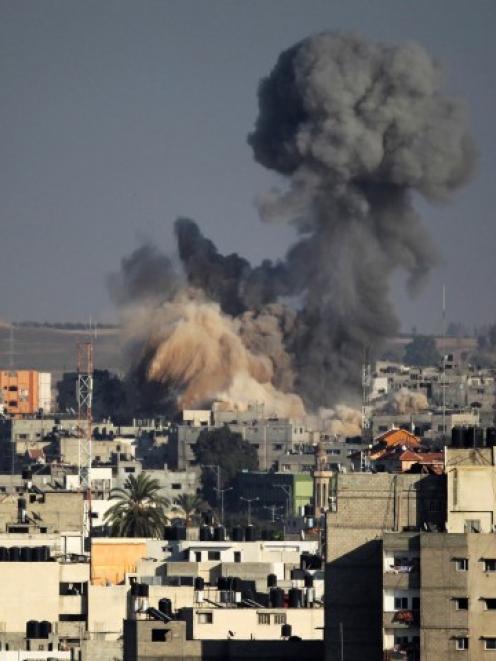 Smoke rises after an explosion in what witnesses said was an Israeli air strike in Gaza. REUTERS...