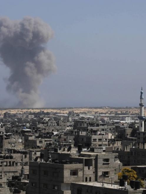 Smoke rises following what witnesses said was an Israeli air strike in Rafah in the southern Gaza...