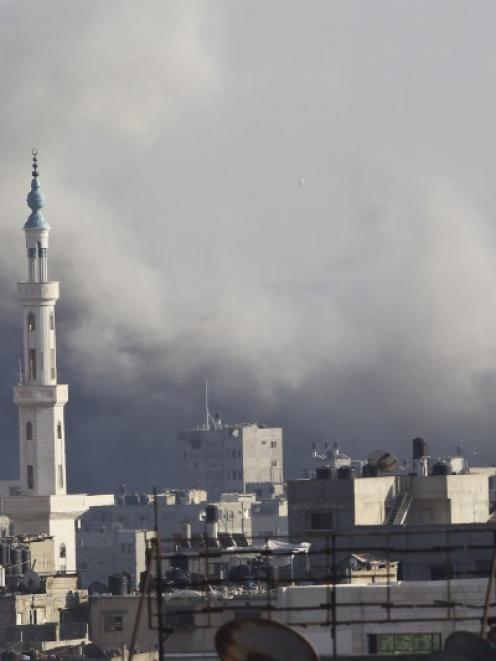 Smoke rises following what witnesses said was an Israeli air strike in Gaza City. Photo by Reuters