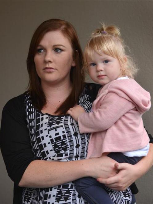 Solo mother Nikkita Burgess-Moyle,  holding her 17-month-old daughter Poppy, is disappointed with...