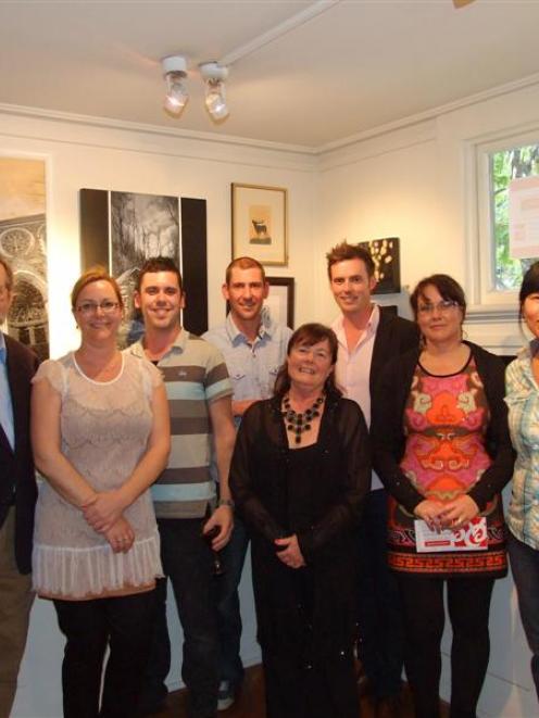 Some of the award winners with Judge Mark Moran and Queenstown Art Society president Sue Wademan....