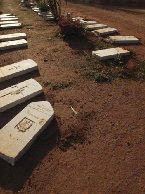 Some of the desecrated graves at Benghazi. Photo by Reuters.
