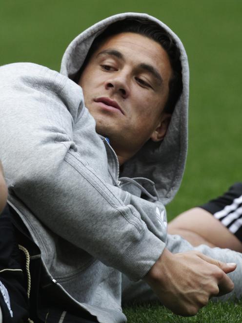 Sonny Bill Williams lies on the ground during the All Blacks captain's run ahead of their Tri...