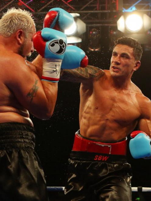 Sonny Bill Williams punches Francois Botha during their recent fight in Brisbane. Photo by Getty