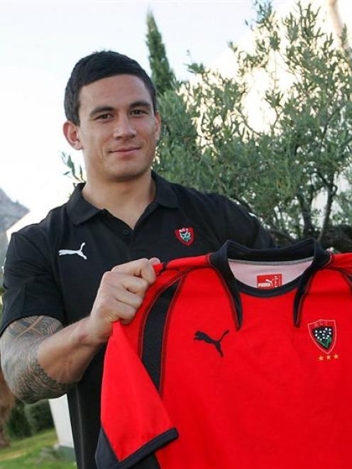 Sonny Bill Williams signs for French Rugby Union side Toulon yesterday. Photo by NZPA.