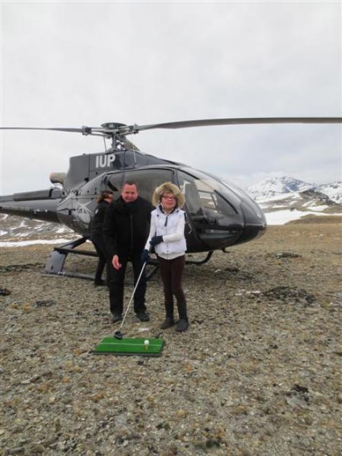 Sophie Newbold, of Gibbston, tees off on the Remarkables mountain range with Peugeot New Zealand...