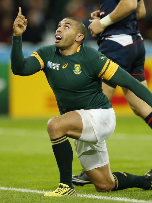 South Africa's Bryan Habana celebrates scoring a try during his team's Pool B match against the...