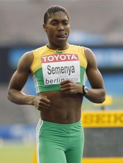 South Africa's Caster Semenya pauses after competing in a Women's 800m semifinal at the World...