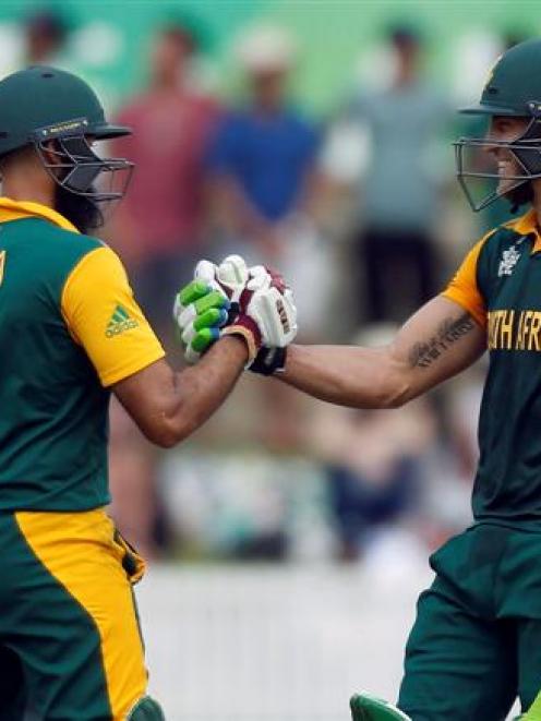 South Africa's Faf du Plessis (R) celebrates with teammate Hashim Amla after reaching his century...