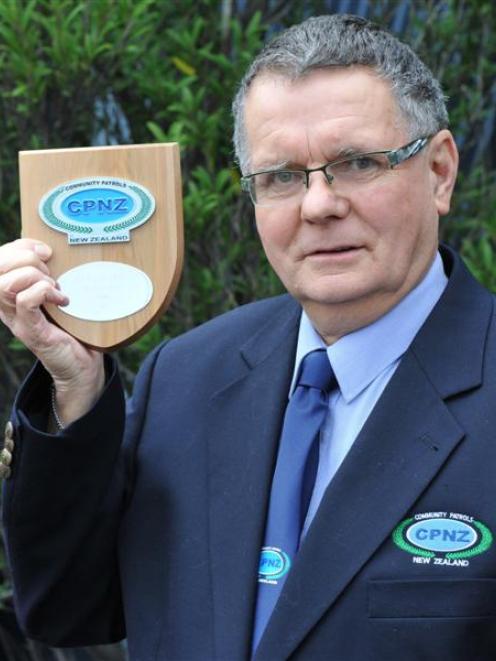 South Dunedin Community Patrol chairman Tubby Hopkins with his Silver Award. Photo by Craig Baxter.