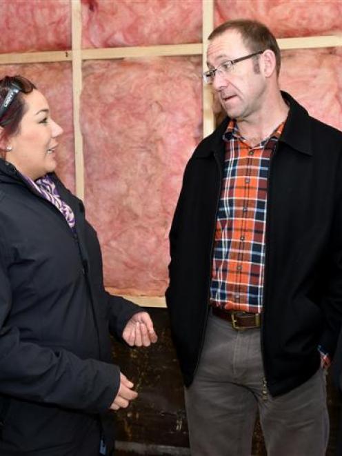 South Dunedin residents Waverleigh Jenkins and her son Gabriel (9) give Labour leader Andrew...