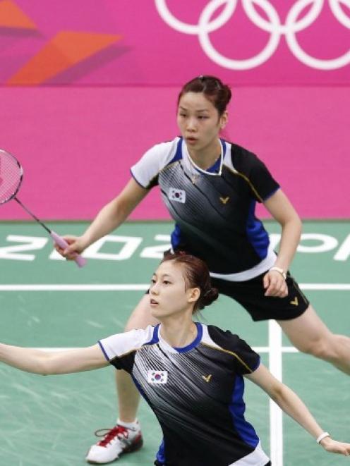 South Korea's women's doubles badminton players Jung Kyung Eun (top) and Kim Ha Na, who are among...