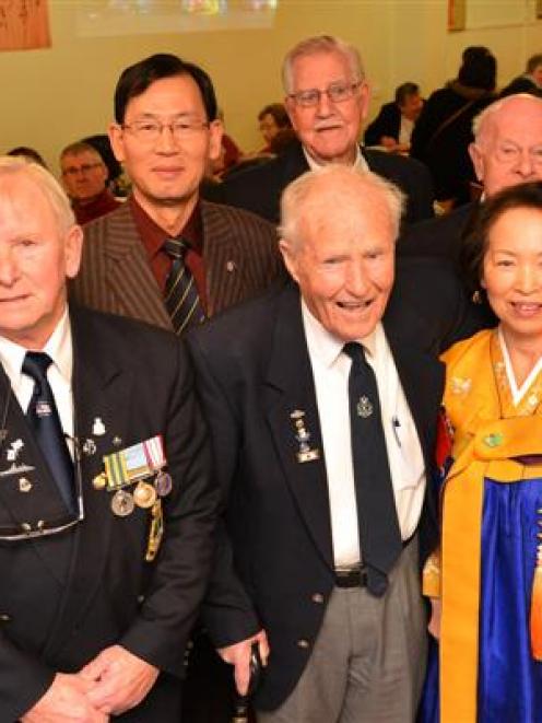 South Korean ambassador to New Zealand Yongkyu Park (fourth from left) gathers with Korean War...