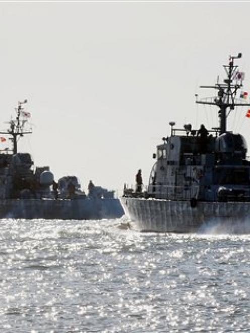 South Korean Navy ships sail near Yeonpyeong Island, South Korea this week. (AP Photo/Yonhap, Kim...