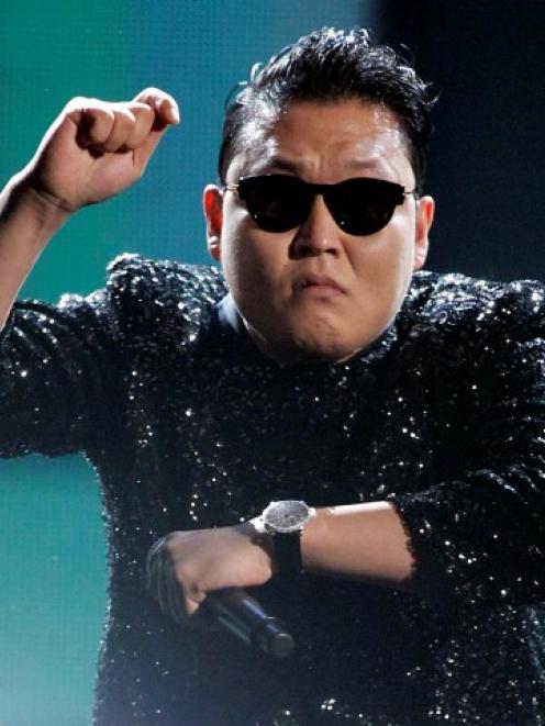 South Korean rapper Psy performs 'Gangnam Style' at the 40th American Music Awards in Los Angeles...