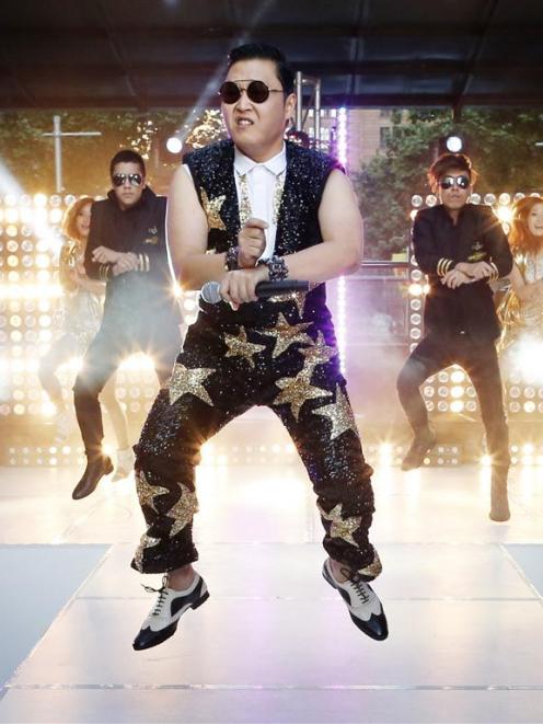 South Korean singer Psy performs his hit Gangnam Style during a morning television appearance in...