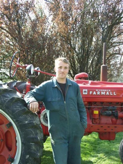 South Otago vintage machinery club secretary Cameron Clark with a 1945 Farmall H vintage tractor....