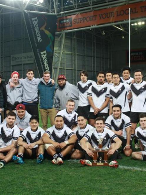 South Pacific Raiders players and support staff celebrate their win in the Otago Rugby League...