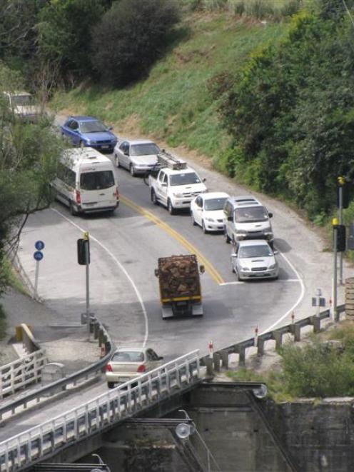 Southbound traffic awaits the green light on the one-lane Kawarau Falls bridge. Photo by Matt...