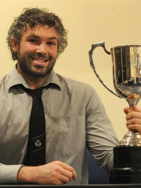 Southern No 8 Andrew Stead holds the trophy for the Dunedin club rugby player of the year at an...
