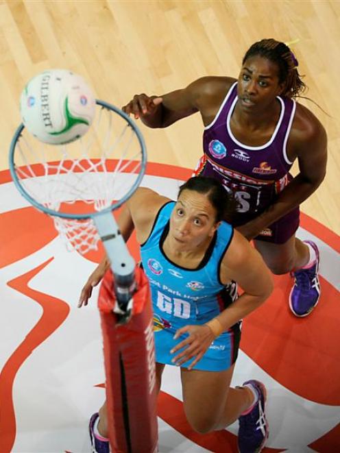 Southern Steel goal defence Rachel Rasmussen (left) can only watch as Queensland Firebirds goal...