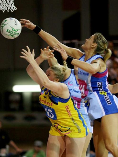 Southern Steel goal keep Leana de Bruin reaches over Central Pulse goal shoot Caitlin Thwaites to...