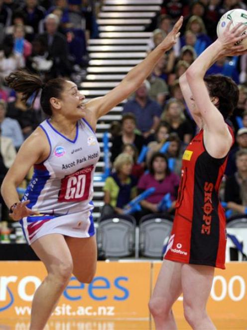 Southern Steel's Sheryl Scanlan, left, attempts to block Canterbury Tactix's Angela Mitchell's...