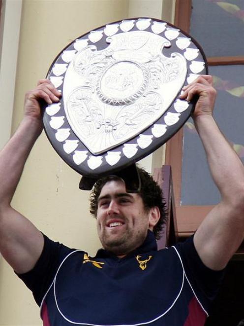 Southland Stags captain Jamie Mackintosh holding the Ranfurly Shield. Photo by NZPA.