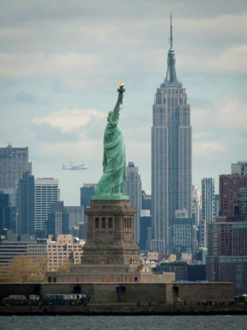 Space Shuttle Enterprise, mounted atop a NASA 747 Shuttle Carrier Aircraft, is seen in the...