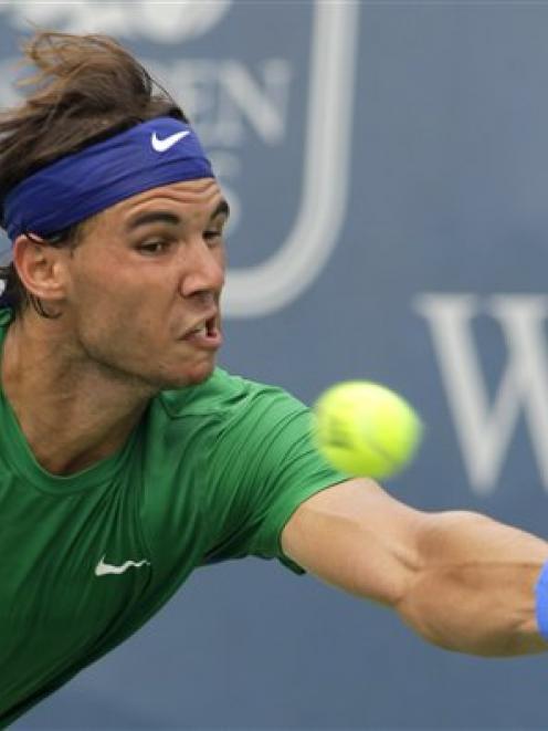 Spain's Rafael Nadal hits a forehand against US player Mardy Fish in a quarterfinal match at the...
