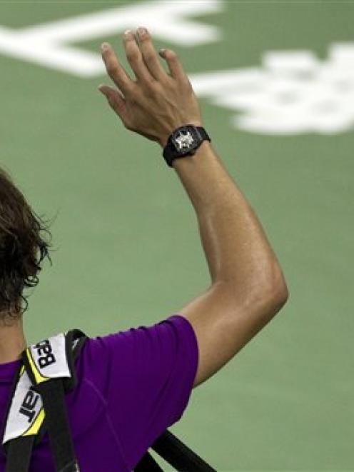Spain's Rafael Nadal waves to spectators after losing his third-round match to Florian Mayer of...