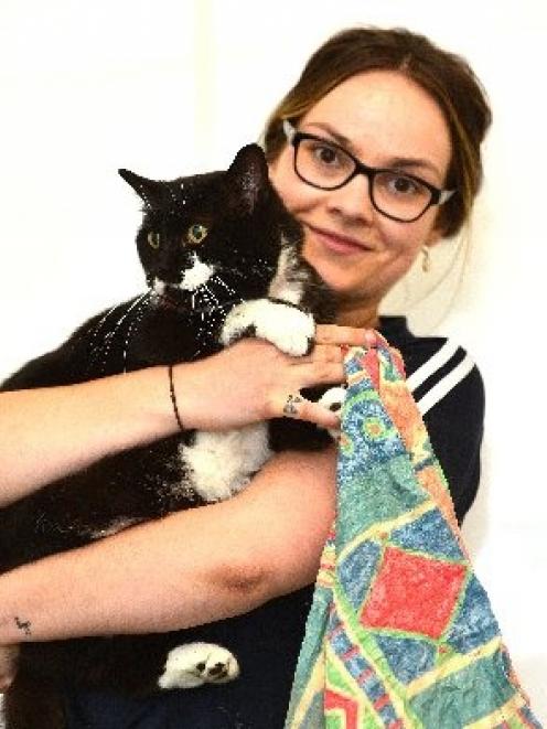 SPCA Otago animal manager Grace Hepburn  holds the cat that was dumped, in a tied pillowcase, on...