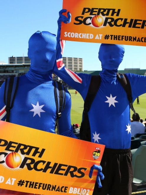 Spectators show their support during the Big Bash League final between the Perth Scorchers and...