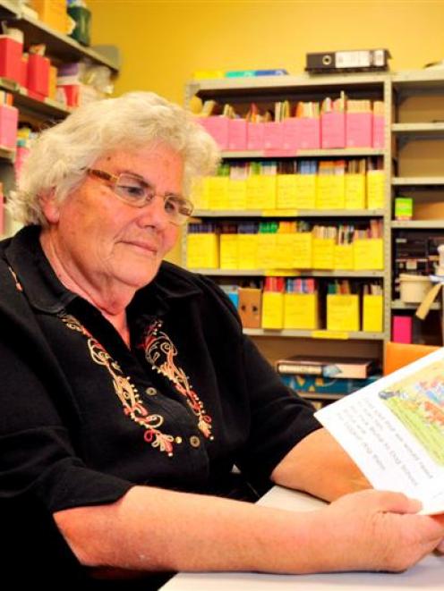 Speld teacher Jean Roulston in the book room at Community House in Dunedin yesterday, with the...