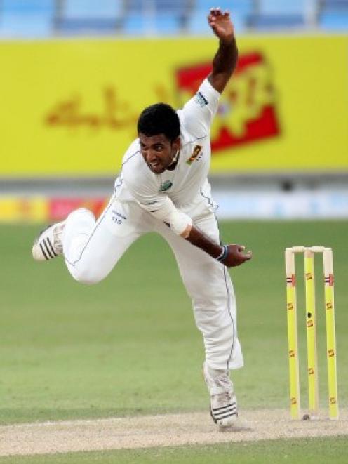 Sri Lanka's Dammika Prasad bowls during the first day of the second test against Pakistan in...