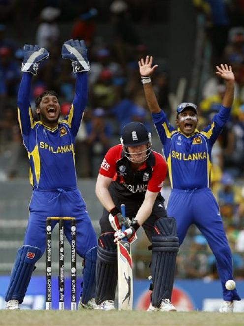 Sri Lanka's wicketkeeper Kumar Sangakkara, left, and Mahela Jayawardene, right, unsuccessfully...