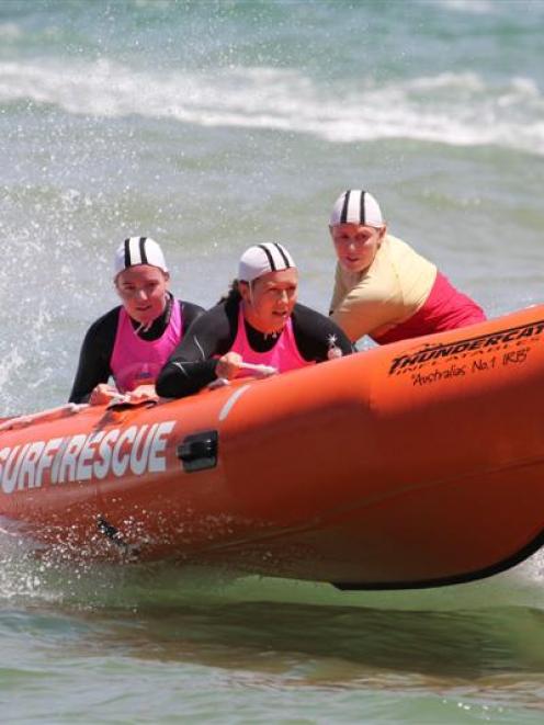 St Clair surf life-savers (from left) Rachel Craythorn (patient), Carla Laughton and Steph...