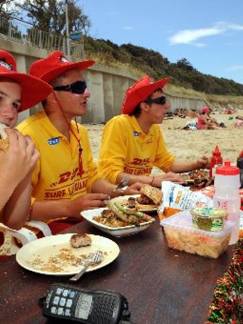 St Clair surf lifeguards (from left) Kim Martyn (16), Scott Fraser (20) and Abe Kemp (19) have a...