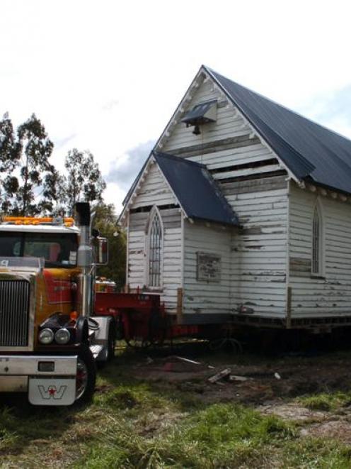 St Mary's Anglican Church, Stirling, sits atop a truck awaiting its 135km trip to its new home in...