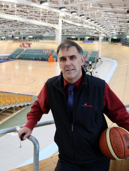 Stadium Southland general manager Nigel Skelt checks out the wooden court installed in the centre...