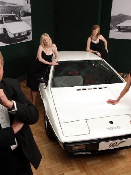 Staff from Bonhams auctioneers pose with the Lotus Esprit from 'The Spy Who Loved Me' in this...