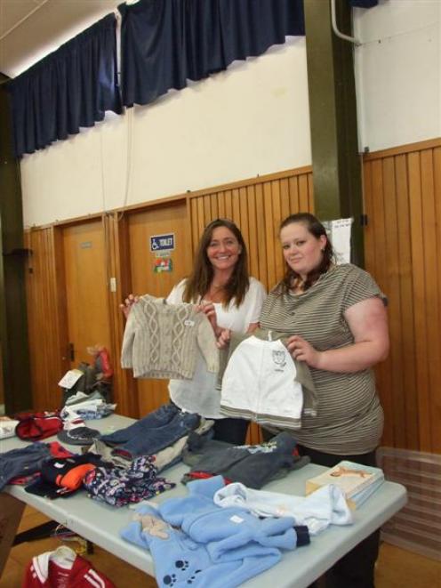 Stallholder Natalie McAuliffe (left) and Belinda Ricketts stand behind one of the 23 stalls