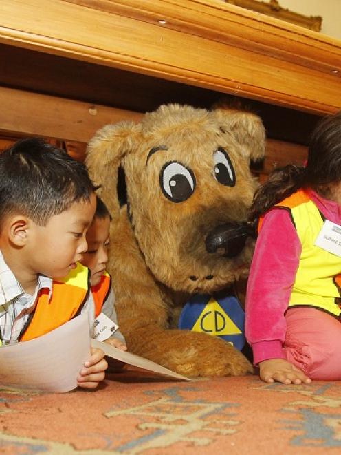 Stan the Civil Defence dog joins children and staff from the Henderson Edukids Early Childcare...