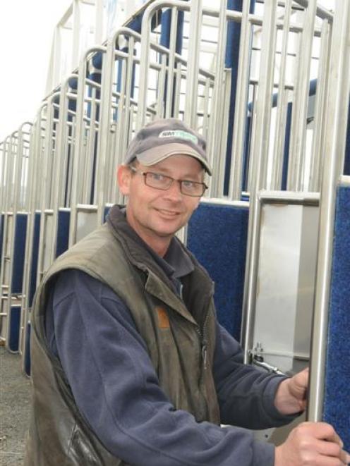 Starter Peter Kennedy working on the new starting gates at Wingatui yesterday. Photo by Tayler...