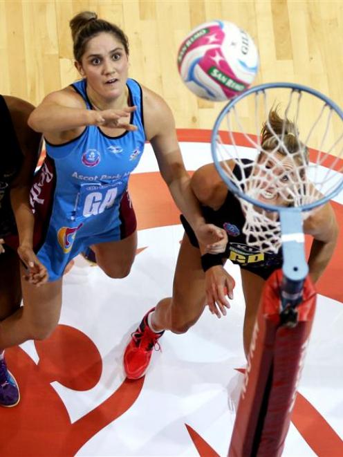 Steel goal attack Te Paea Selby Rickit (centre) shoots for  goal while Magic defenders Kristiana...